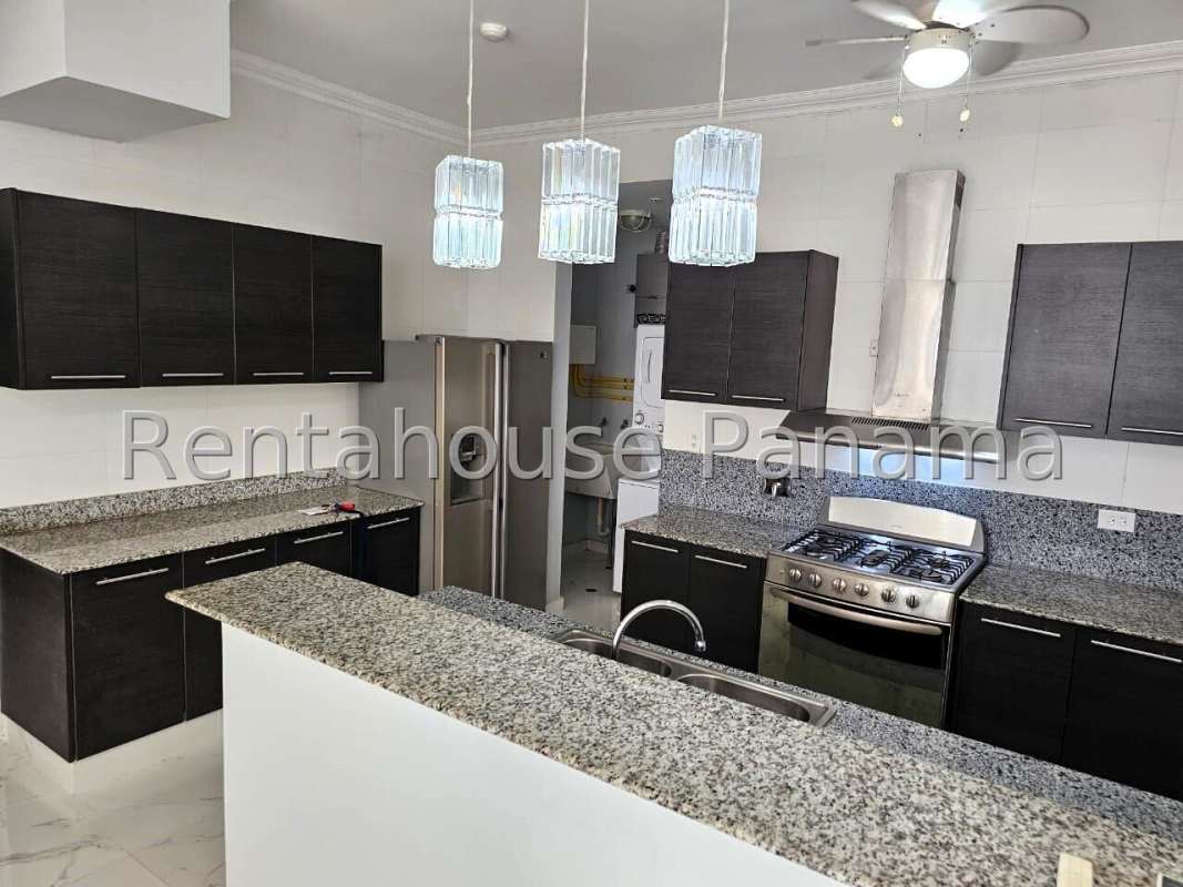 Spacious living-dining room with panoramic windows leading to terrace balcony in PH Quadrat