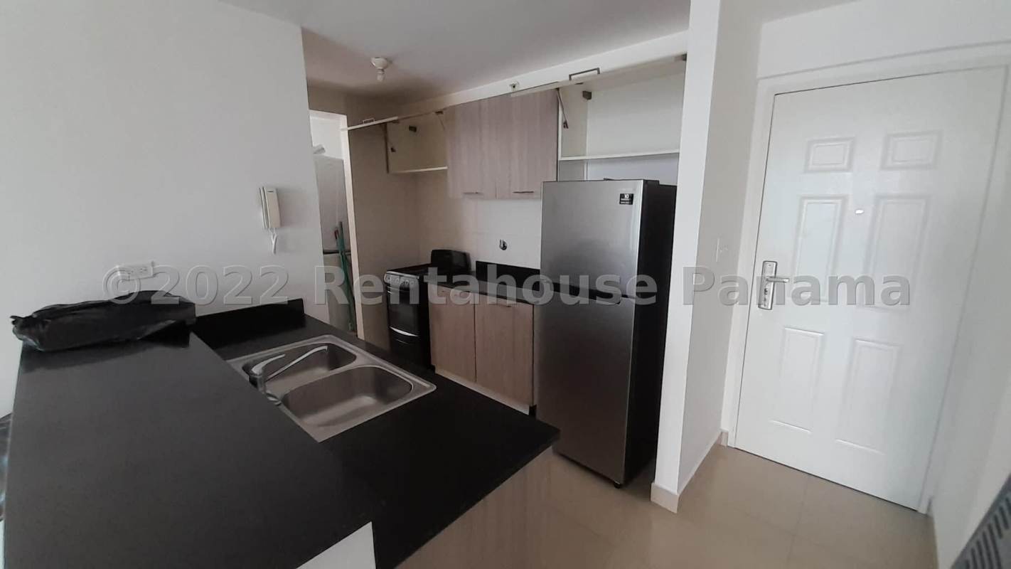 Balcony with glass railing and city skyline view from apartment in PH Coral Towers Carrasquilla