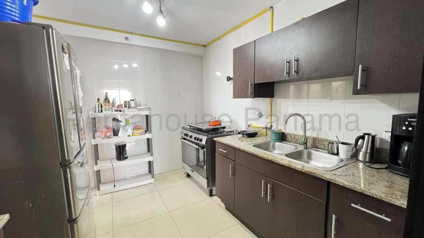 Spacious bedroom with closet and window overlooking Panama City at Obarrio Tower