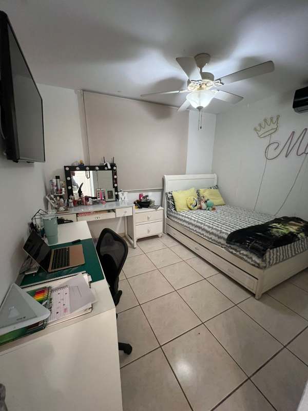 Children's room with bed, study desk, vanity, playful decor in house Brisas del Golf Panama