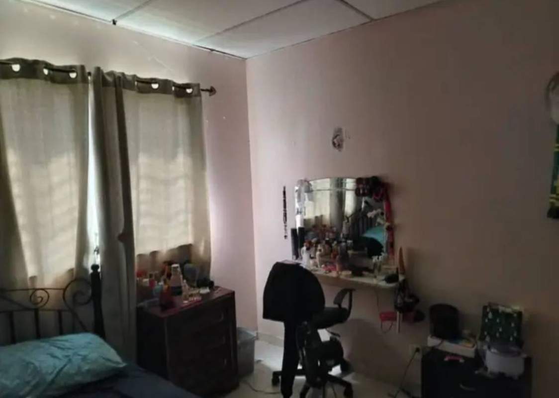 Traditional kitchen with wooden cabinets, dual sink and gas stove in Villas del Mediterráneo Panama