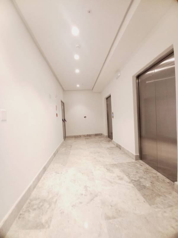 Elegant open kitchen with premium finishes and large island in PH Empire Residences Santa Maria Panama