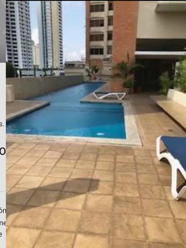 Infinity rooftop swimming pool with panoramic views of Panama City skyline and mountains at PH El Cangrejo Loft Tower