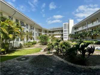 Modern mid-rise condominium building PH Soleo in Panama Pacifico with garden courtyard