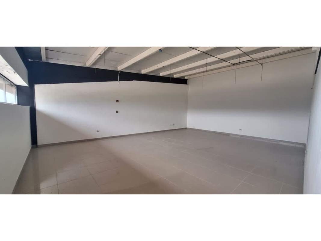 Large open commercial warehouse interior with tiled floors and exposed beams in Panama