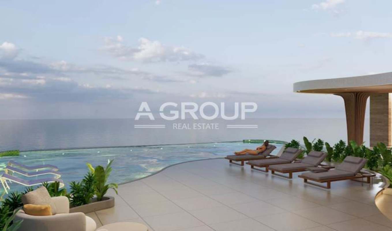 Infinity edge pool with sea view and modern lounge furniture at Allure Punta Pacifica