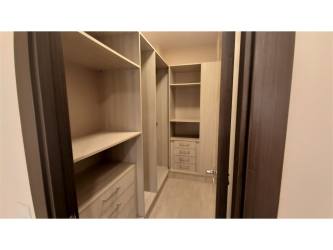 Modern bathroom with granite sink counter and glass shower River Valley Panama Pacifico apartment