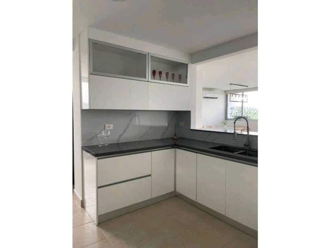 Modern minimalist kitchen with white cabinets marble backsplash apartment rent Clayton Panama