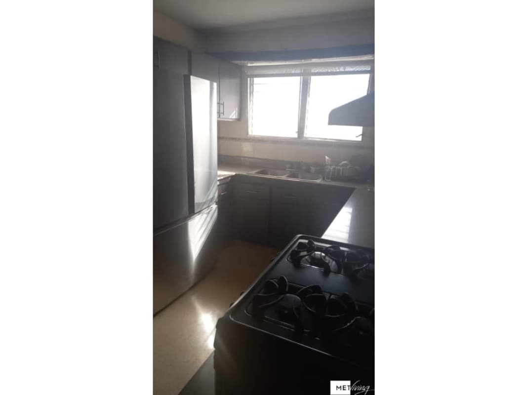 Modern kitchen with appliances and large window PH Metropolitan Tower Panama