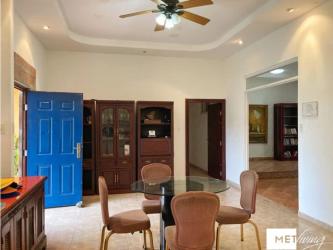 Traditional ranch style facade with front porch and carport in Rancho Los Sueños near Coronado Panama