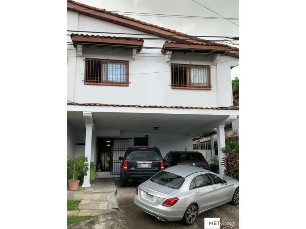 Two-story house with tiled roof, 3-car carport and traditional facade in La Alameda Betania Panama City