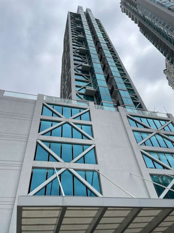 Modern architecture with palm trees at PH Loft Four41 entrance Punta Pacifica Panama