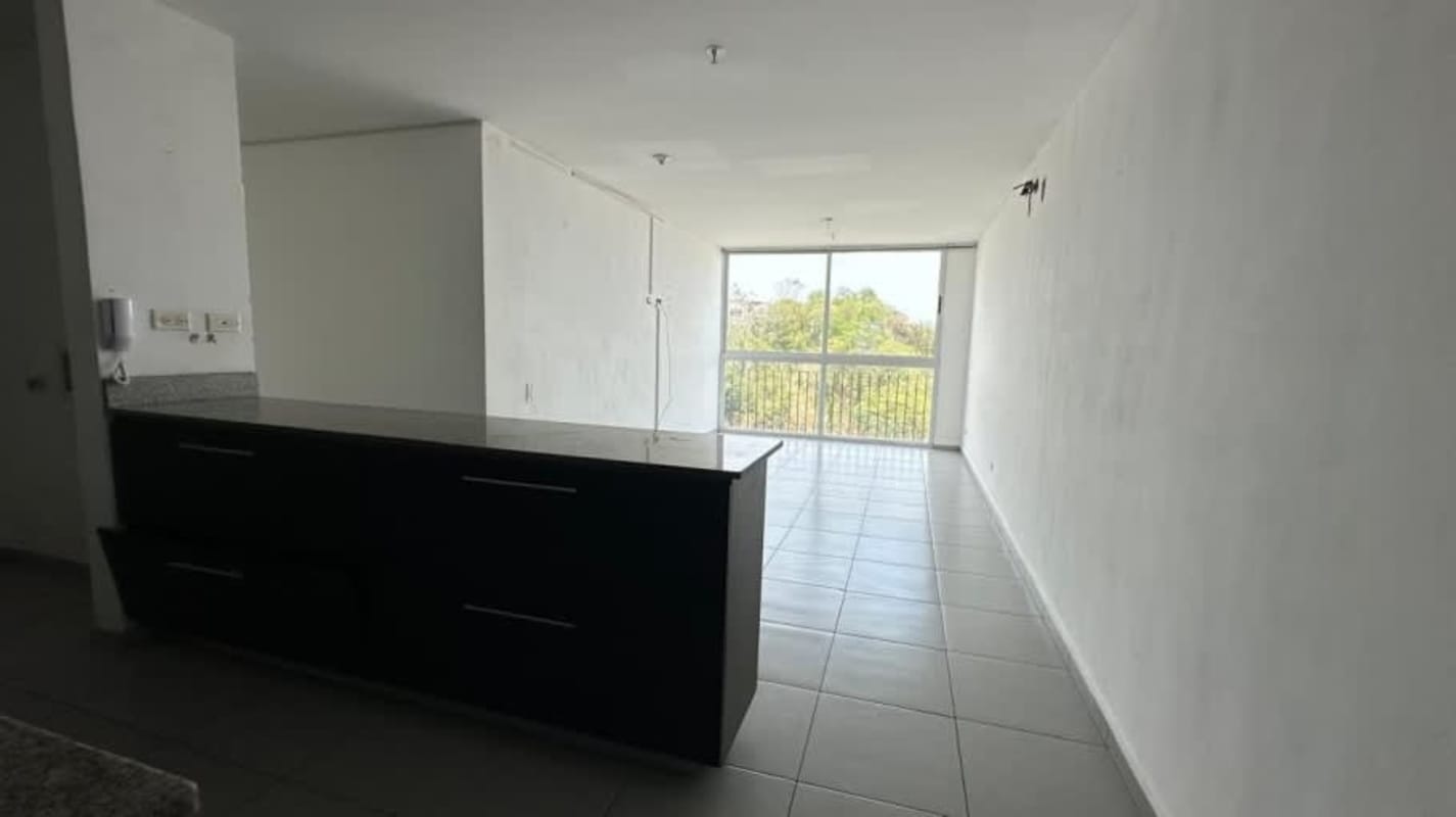 Open-concept bright living dining room with balcony in repossessed Condado del Rey apartment Panama City