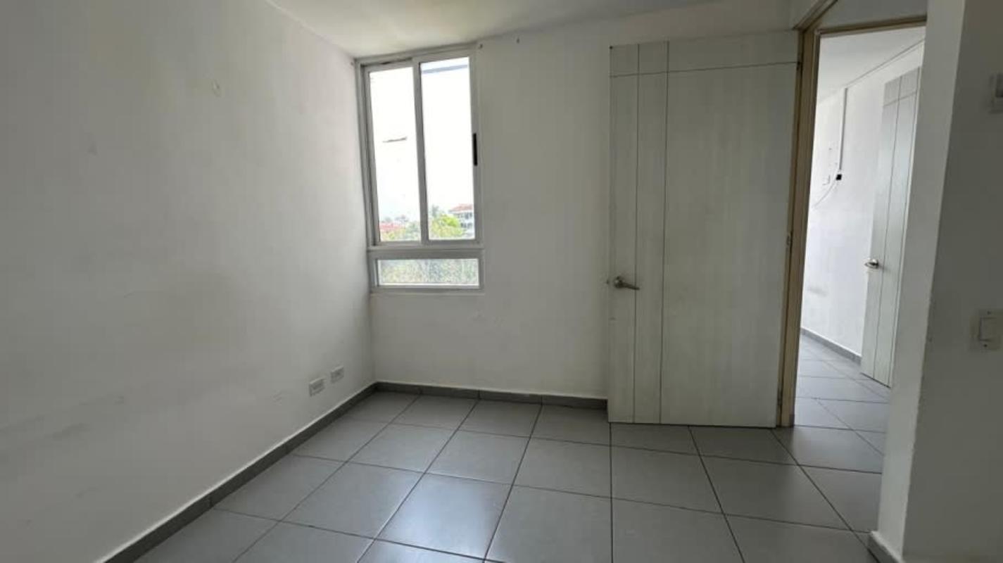 Spacious walk-in closet with built-in shelves and drawers in affordable apartment Panama