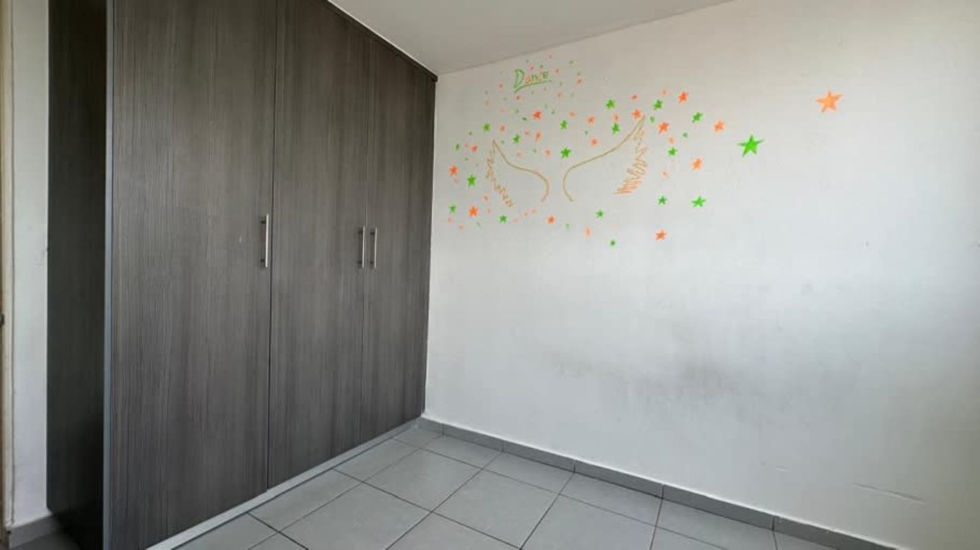 Simple bedroom with built-in gray wardrobe repossessed apartment Condado del Rey Panama City