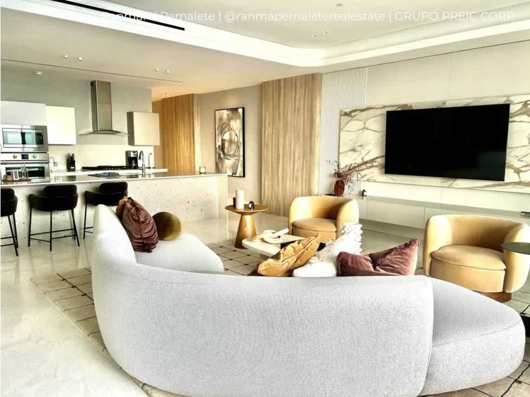 State-of-the-art modern kitchen with marble countertops and appliances in luxury condo Ocean Reef