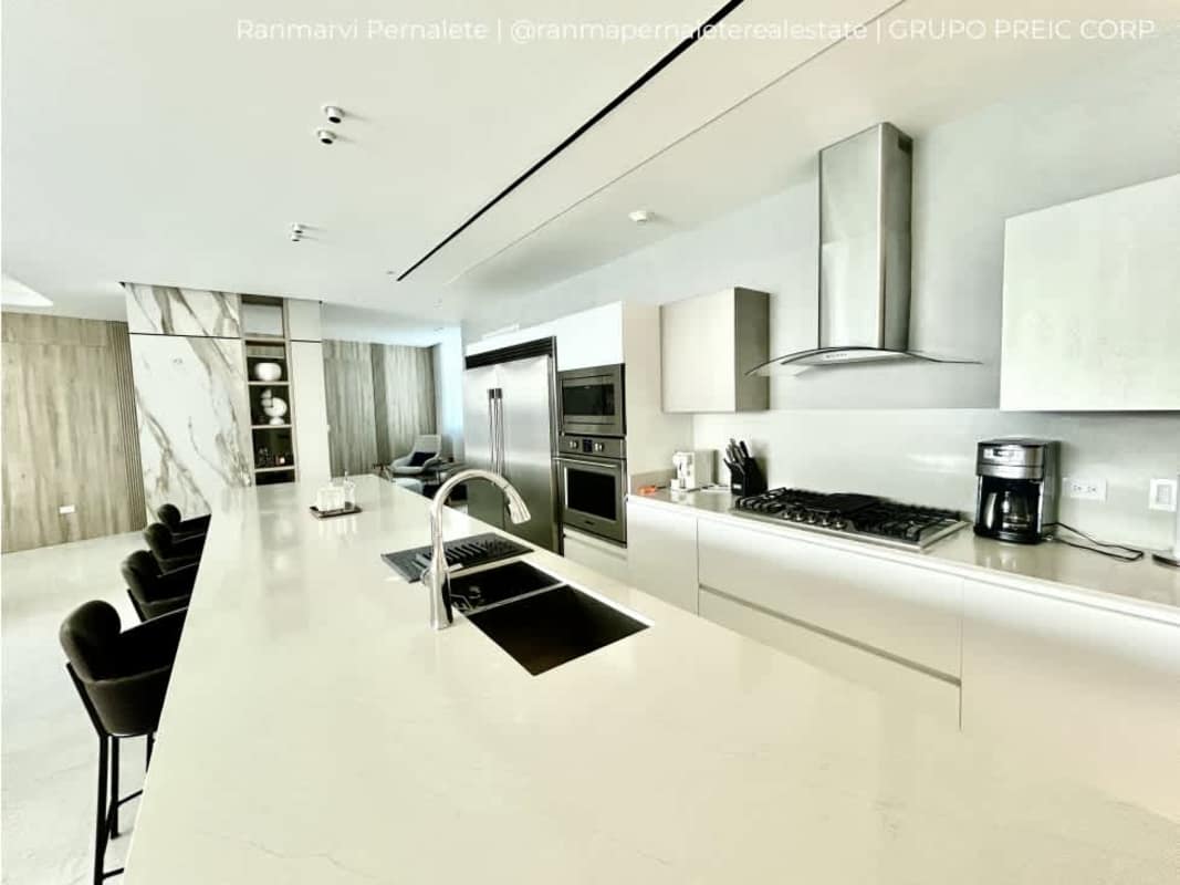 Bedroom suite featuring balcony access and water views luxury apartment Ocean Reef