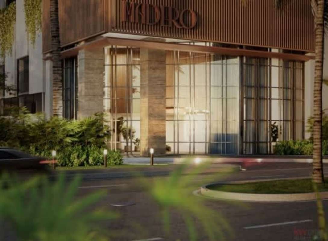 Luxury condo tower with rooftop swimming pool lounge deck palm trees PH Madero Costa del Este Panama