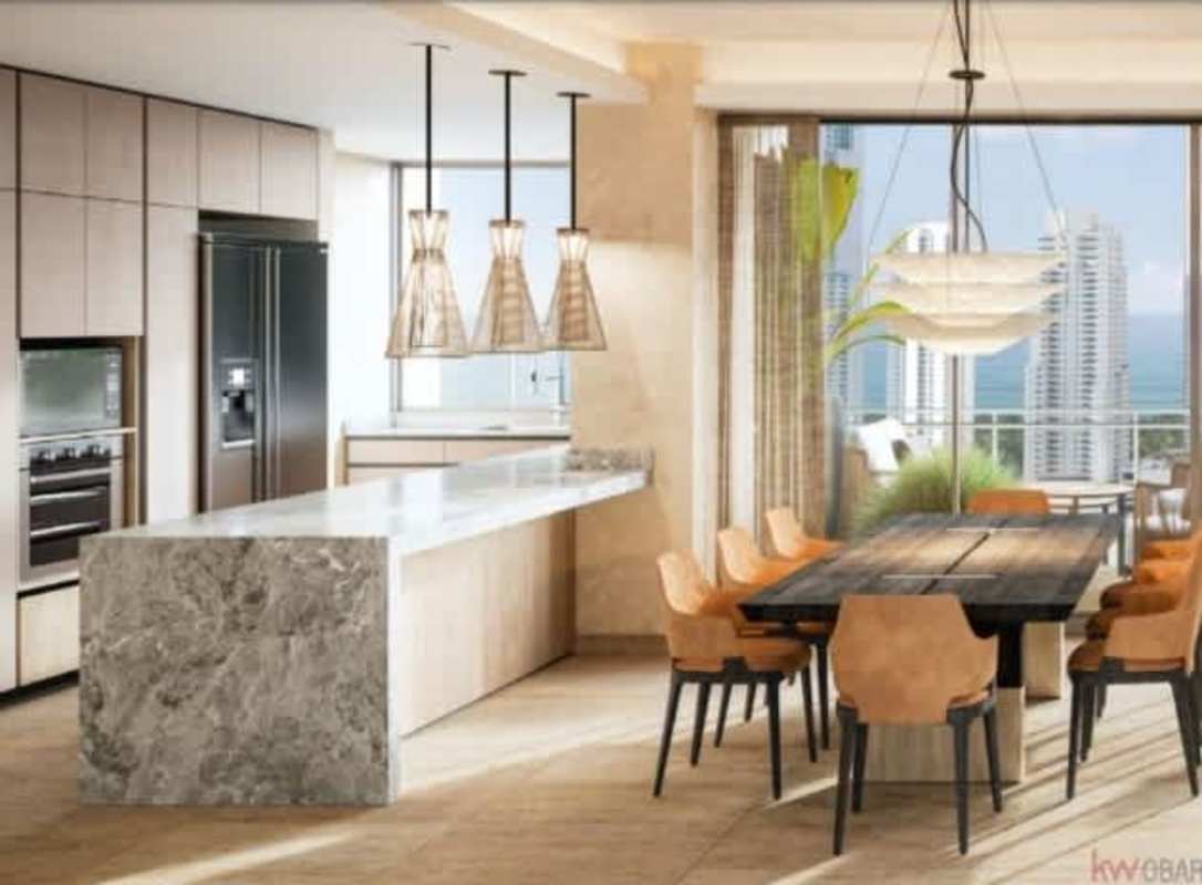 Modern kitchen dining area marble waterfall island ocean views PH Madero Costa del Este Panama