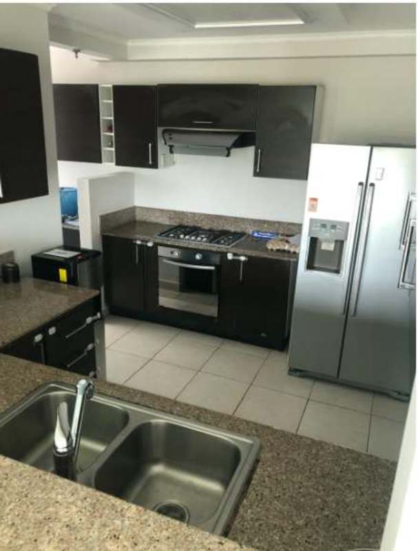 Laundry area with granite countertop, stacked washer dryer PH Clayton Park Panama City