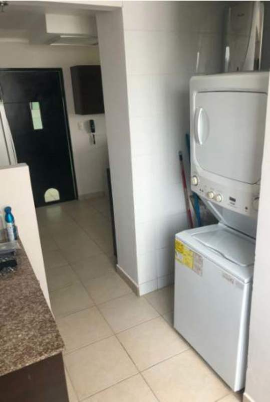 Contemporary dining room with black table, large bright window PH Clayton Park Panama