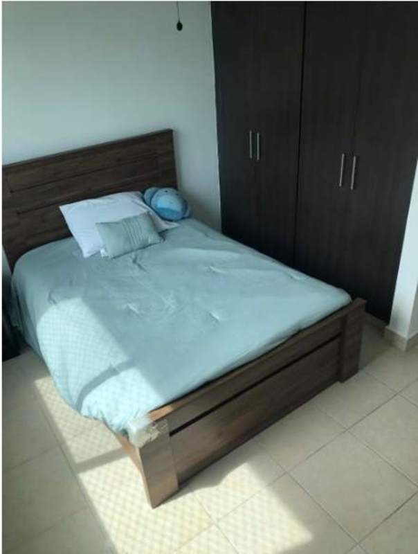 Bedroom with wooden bed, built-in wardrobe PH Clayton Park Panama