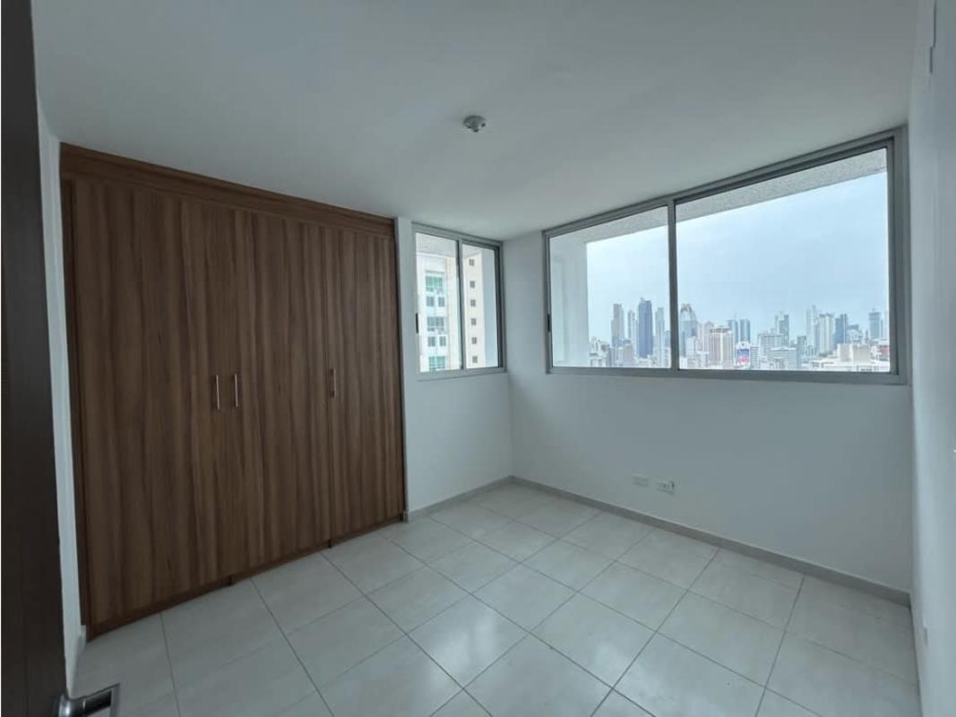 Luxury outdoor pool and Jacuzzi surrounded by lounge chairs at Trinity Tower El Carmen