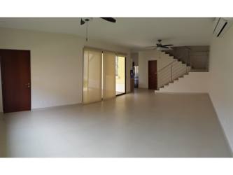 Spacious covered terrace with tiled floor and ceiling fan overlooking private garden in River Valley Panama Pacifico
