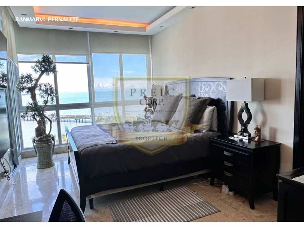 Bedroom with large windows, city skyline and ocean view in PH Ocean Sky