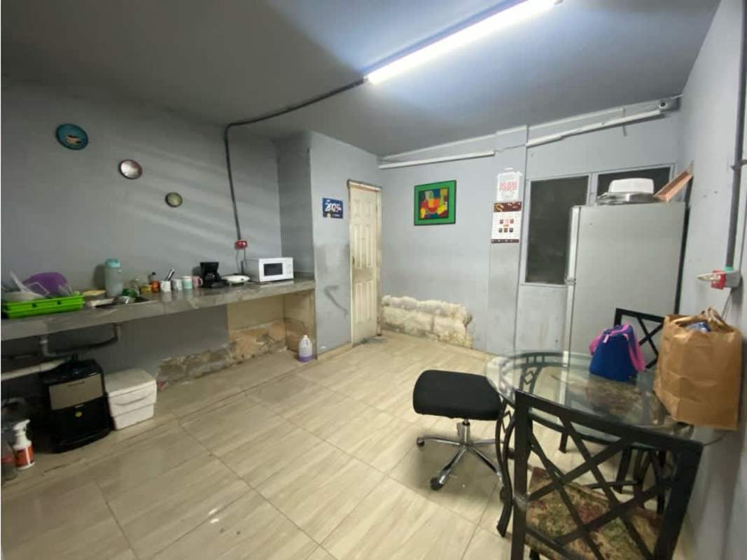 Functional office and print area with partition window, printers, shelves in Commercial Complex Via Transístmica