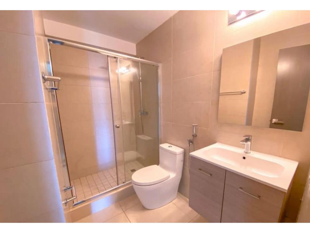 Bathroom with glass-enclosed shower ceramic tiles PH Lumiere Costa del Este Panama
