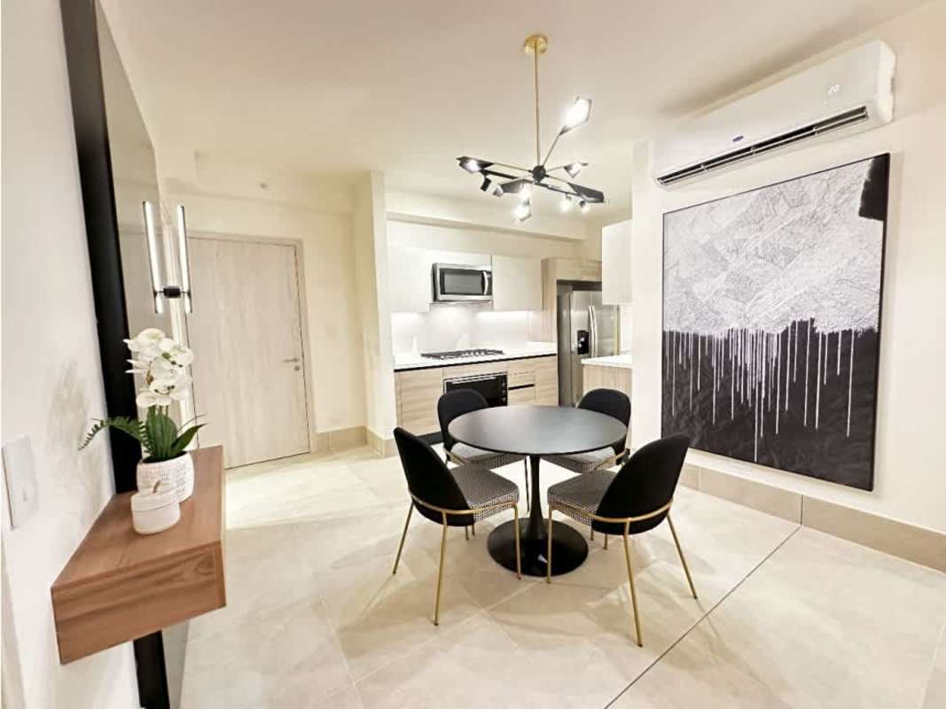 Contemporary open-concept kitchen with quartz countertops and premium appliances PH Ocean House