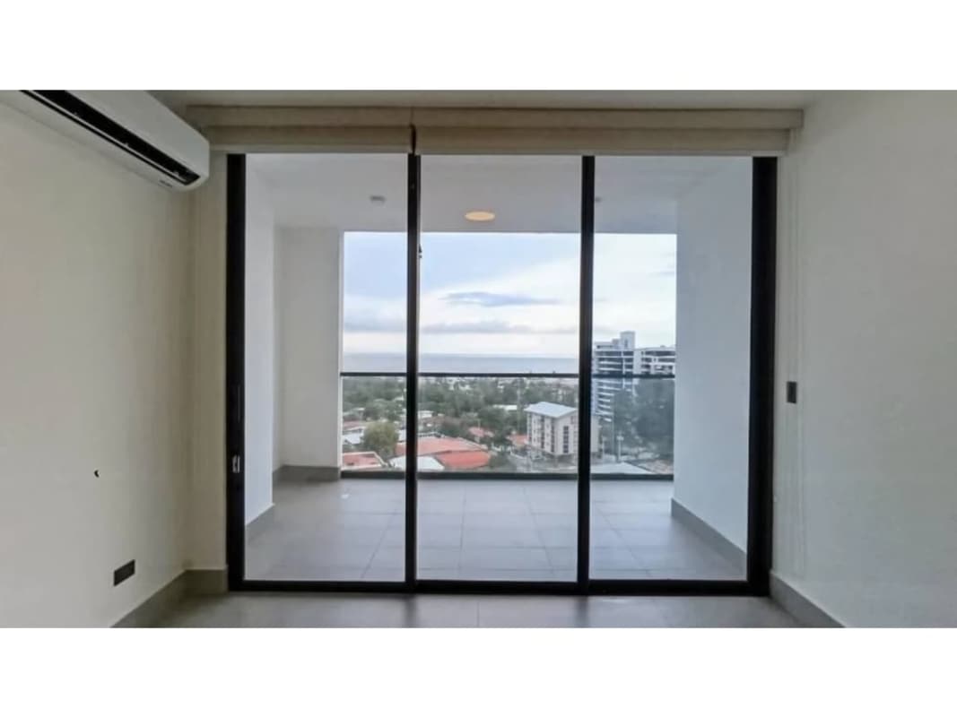 Modern apartment living room with large windows and ocean views in PH Victory Panama