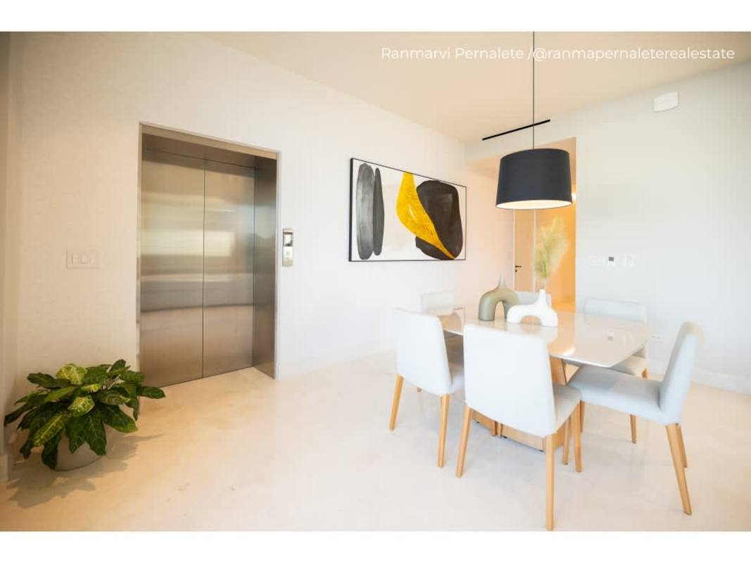 Guest bedroom with floor-to-ceiling windows, built-in closets at Ocean Reef