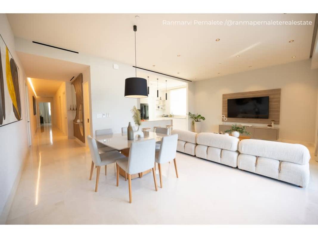 Modern kitchen with island, quartz counters, stainless appliances, Ocean Reef Islands