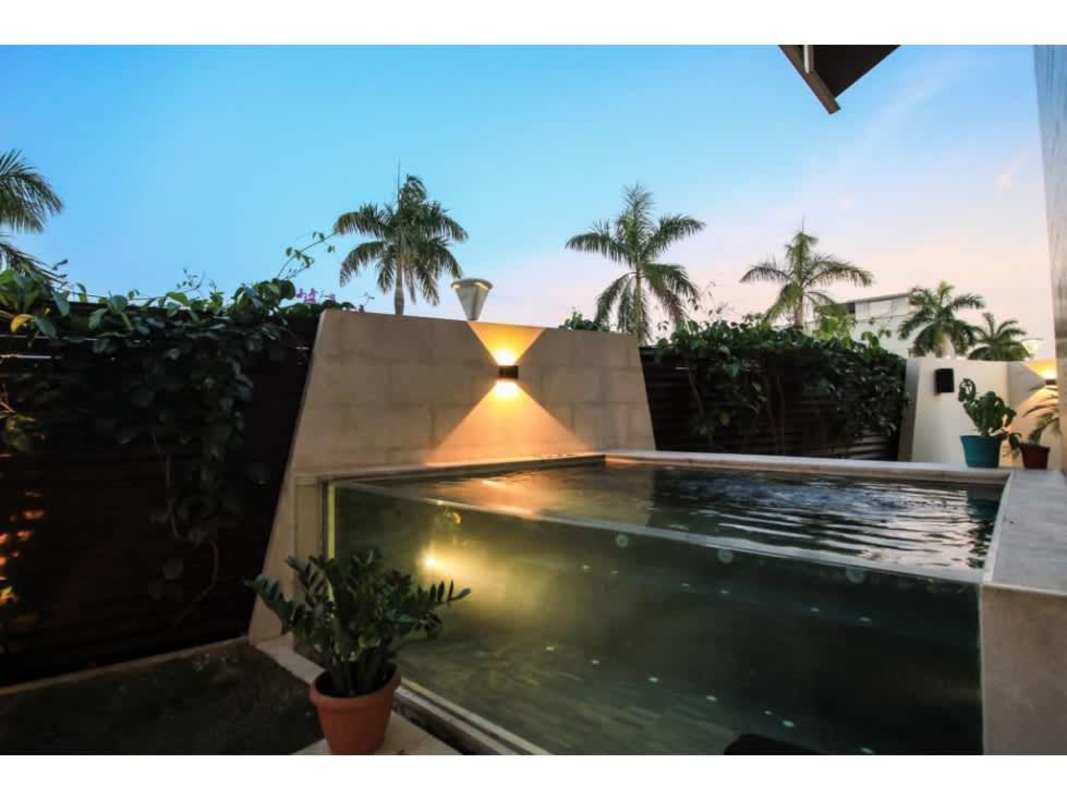 Spacious living area with floor-to-ceiling windows opening to marina view garden terrace Ocean Reef Islands Panama