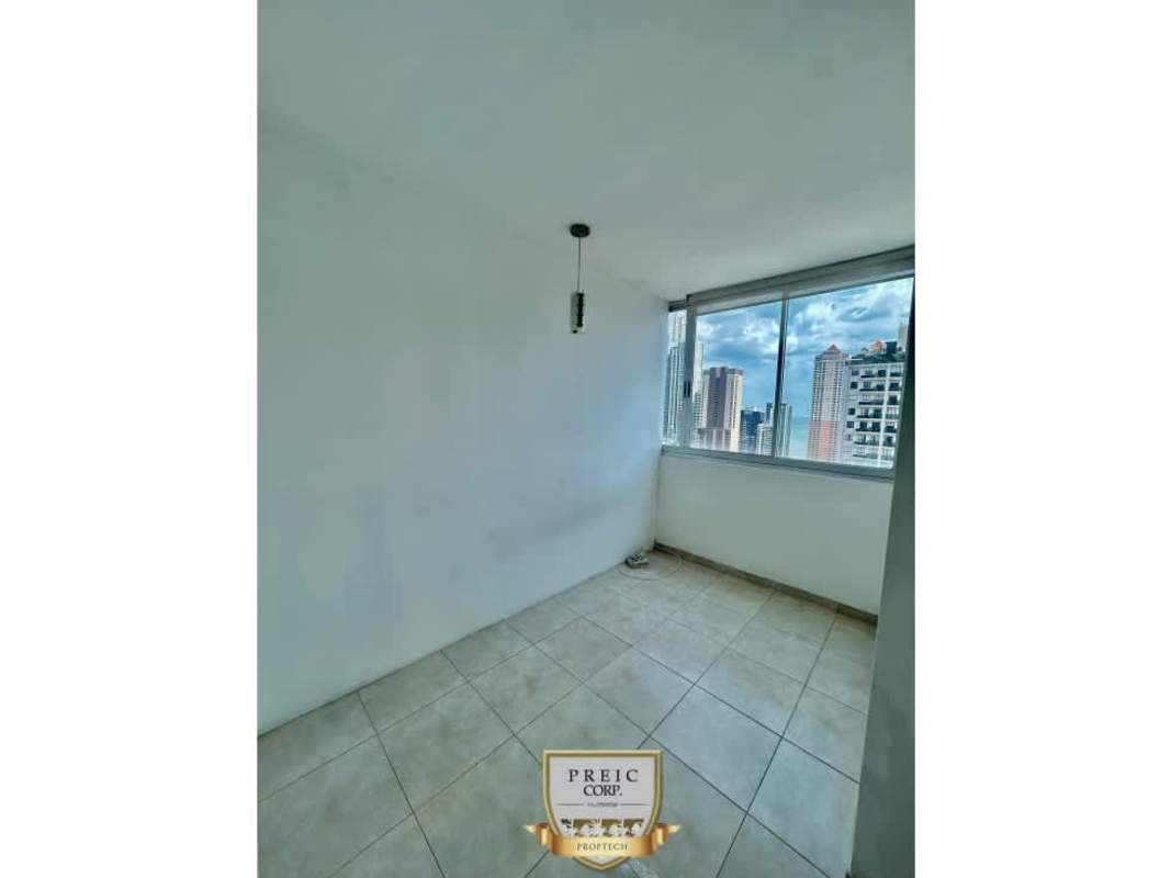 Small bright corner with panoramic skyline views from tall windows in Panama City