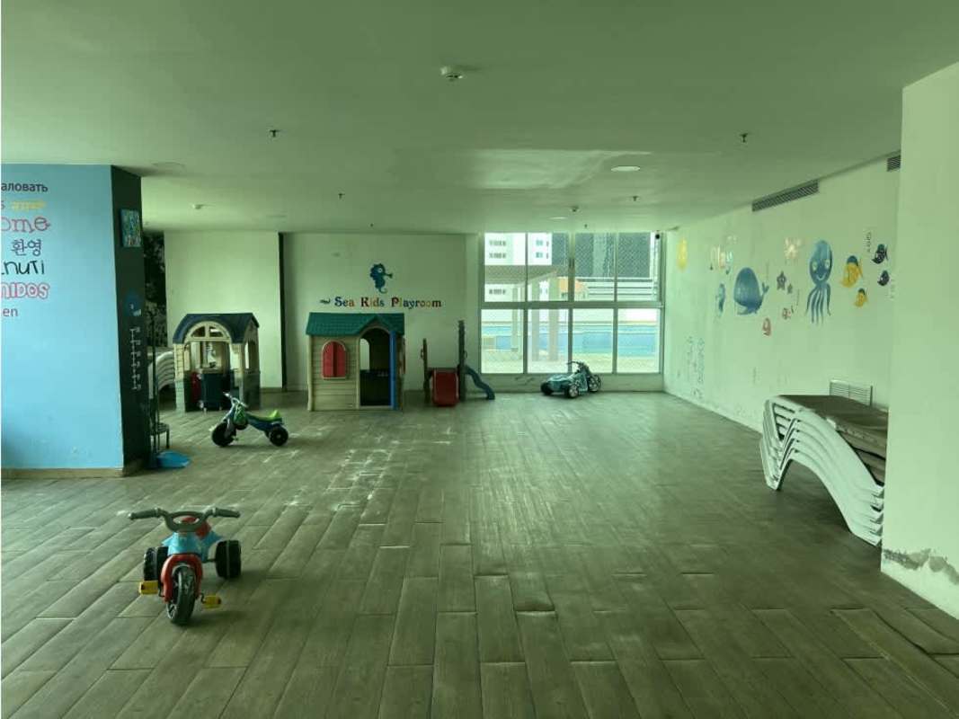 Indoor kids play area with colorful wall murals and play equipment at Seawaves Panama