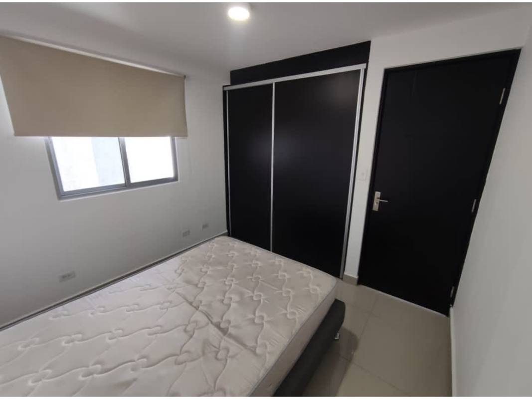 Contemporary kitchen with granite counter, breakfast bar, refrigerator, and stove in PH Coral Tower Panama