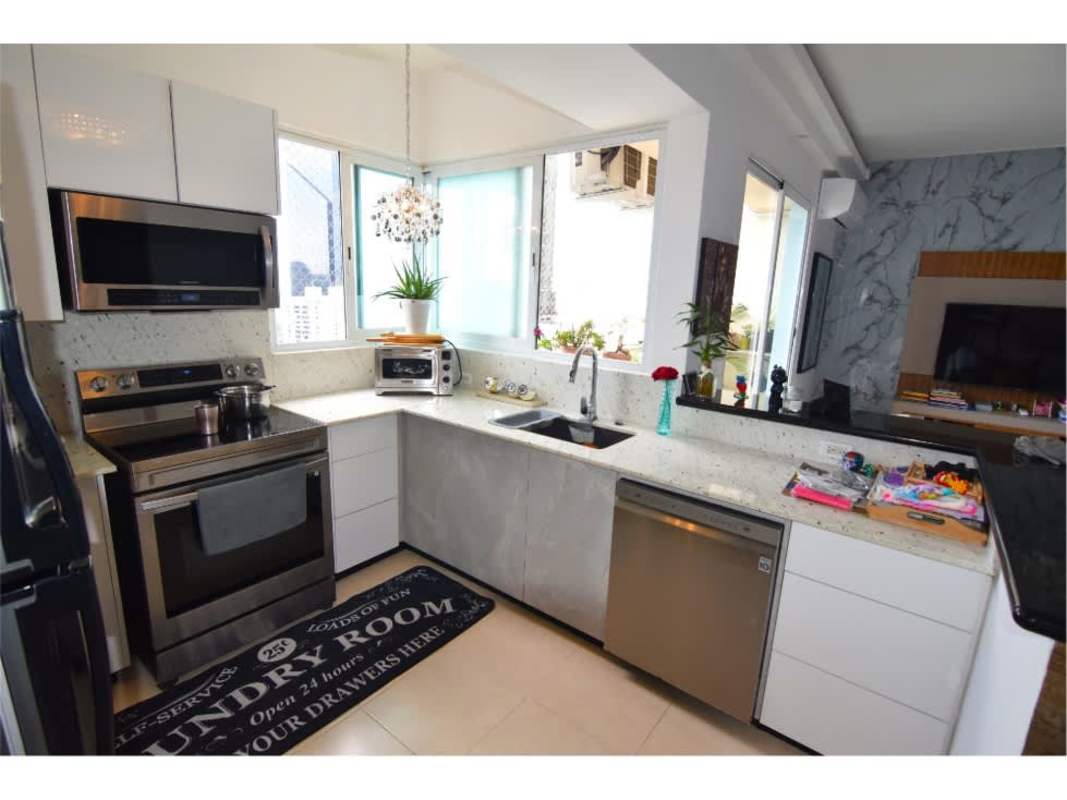 Bedroom with large window and city skyline view PH Vista del Mar Panama