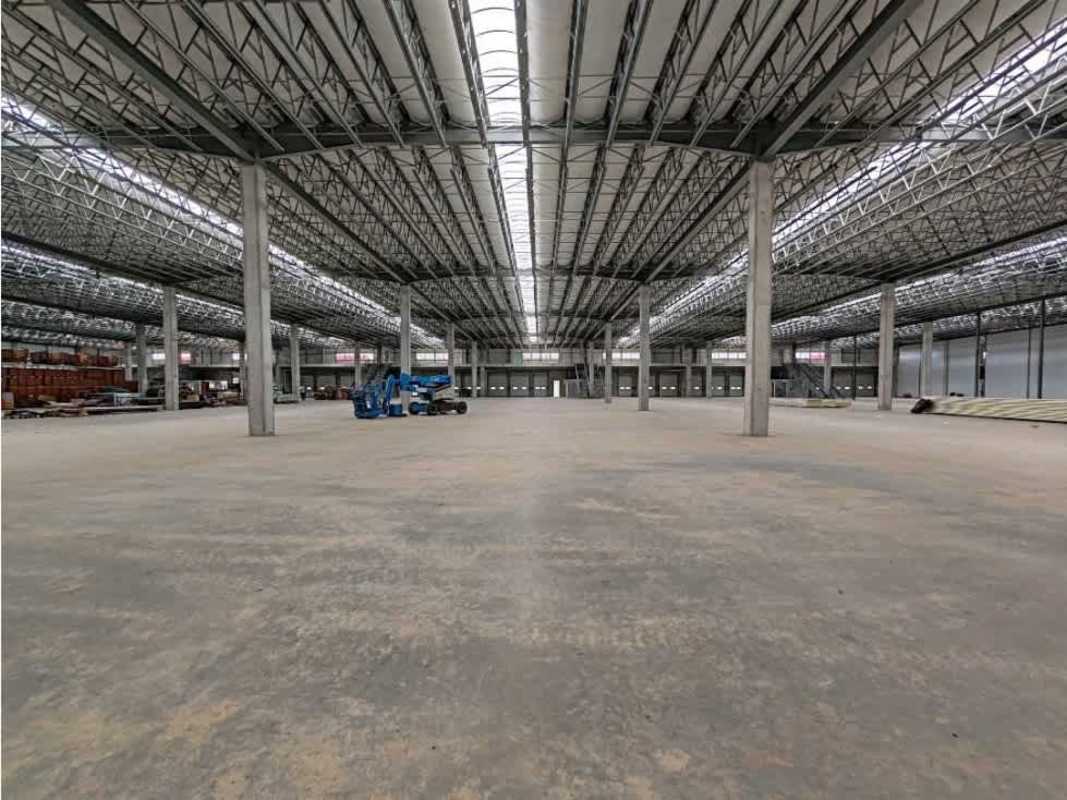 Interior spacious empty warehouse with concrete floor and steel truss ceiling in Costa Sur Panama