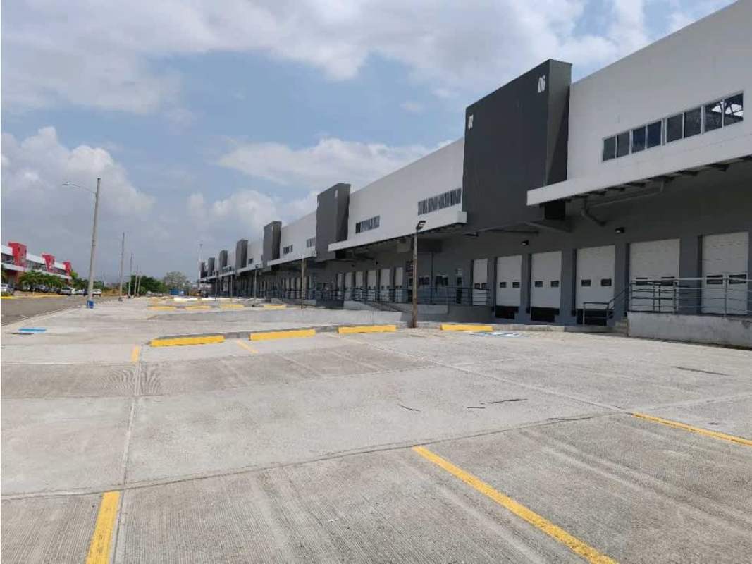 Modern warehouse complex exterior with loading docks and parking in Costa Sur Business Park Panama