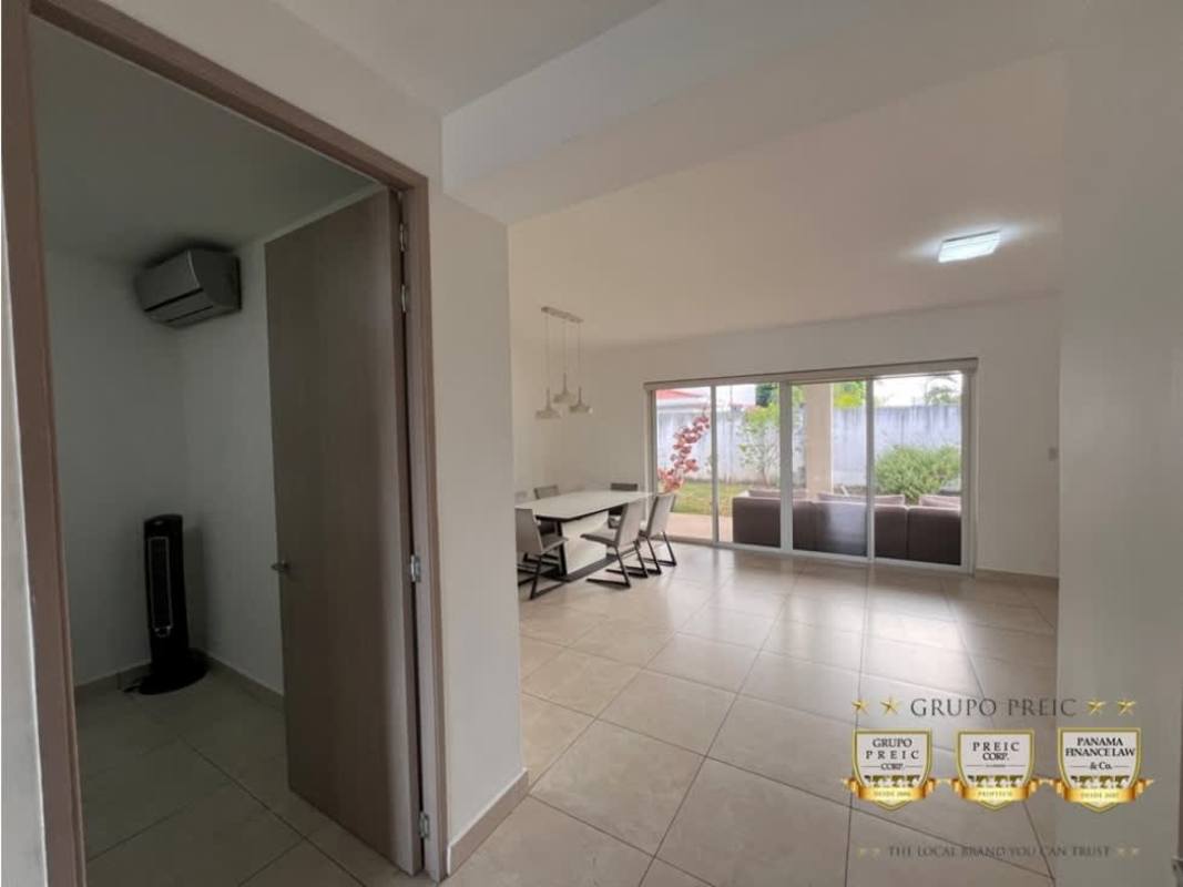 Open living and dining room with sliding doors to terrace Lyon Model Home Reserva de Versalles Panama