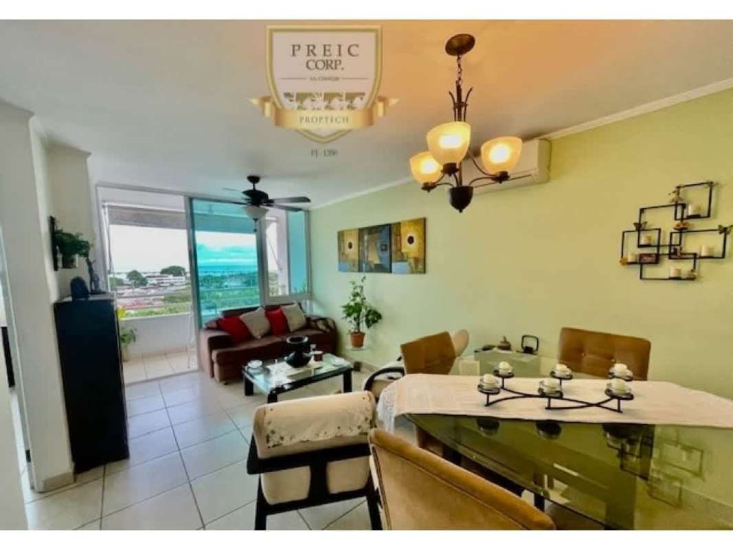 Bright open plan living dining room with sliding doors to balcony city view Parque Lefevre Panama