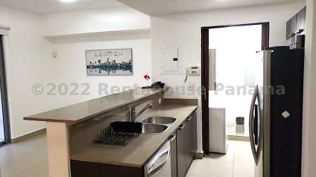 Open kitchen with appliances and porcelain tile flooring in PH Woodlands Panama Pacifico apartment