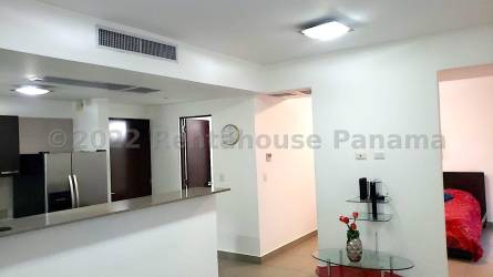 Swimming pool with lounge chairs at PH Woodlands in Panama Pacifico community