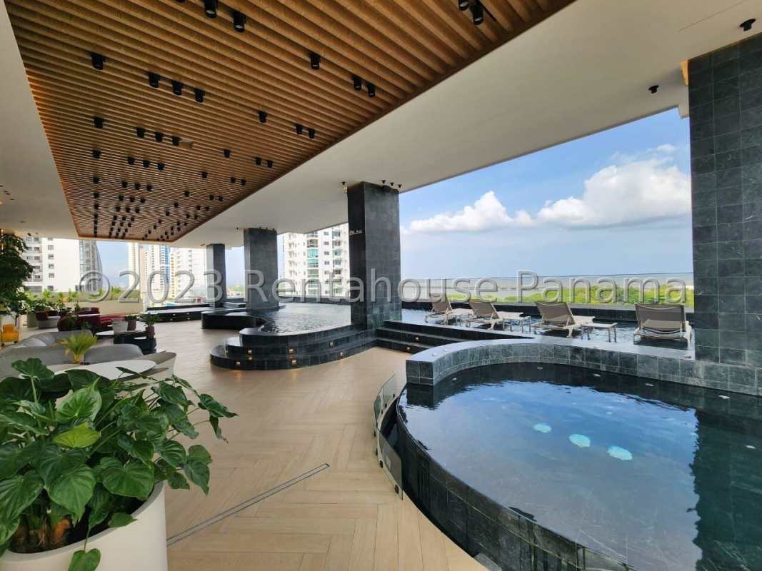 Covered padel court with city skyline view rooftop social area PH Victory Panama