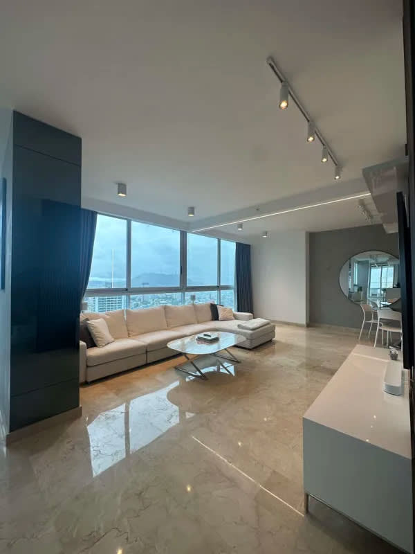 Contemporary penthouse with marble floors, vibrant lighting, panoramic ocean view in Dynasty Residences Panama City