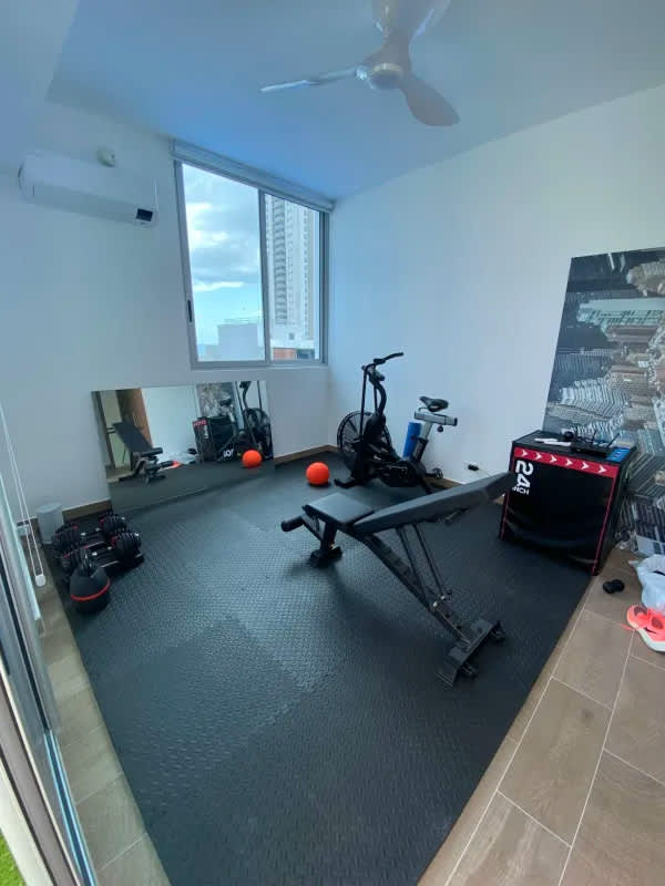 Fully equipped gym with city view, weights, cardio in Dynasty Residences Avenida Balboa Panama