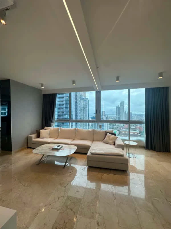 Spacious living area with marble floor and skyline bay view PH Dynasty Residences Avenida Balboa